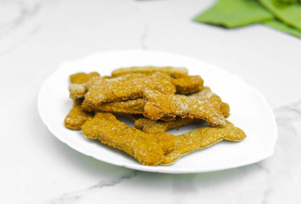 Rolled oat dog treats on a plate.